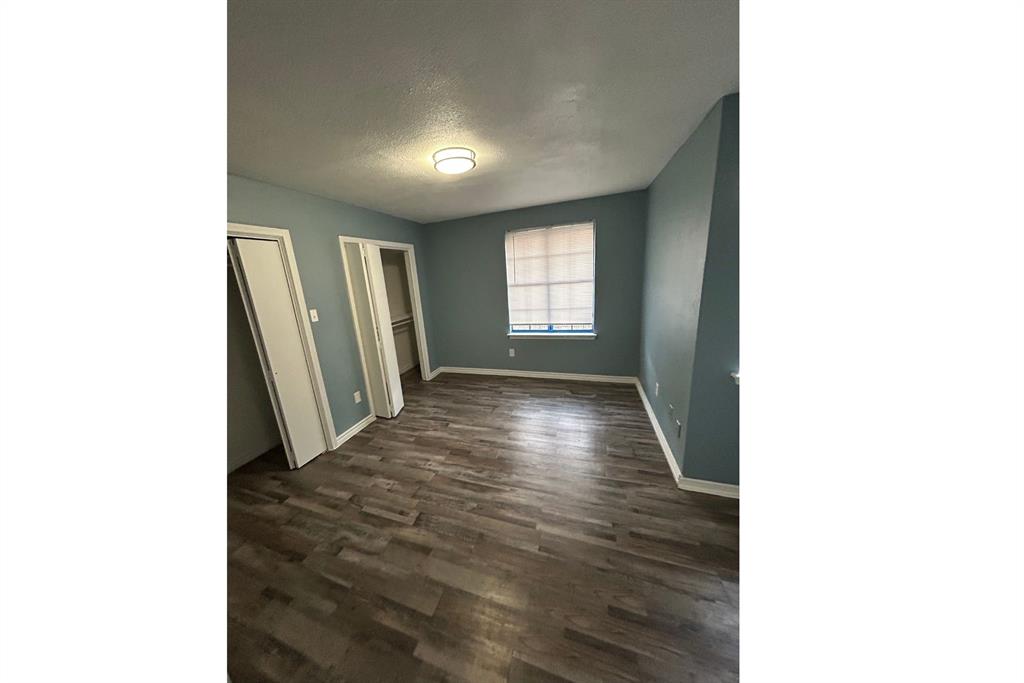 8001 Rothington Road, Unit 3137 Dallas, TX 75227 - Photo 20 of 38 a view of entryway with window and wooden floor