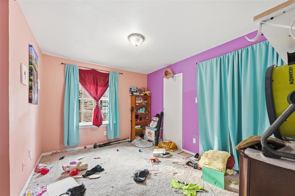 8001 Rothington Road, Unit 3137 Dallas, TX 75227 - Photo 23 of 38 a bedroom with a bed and a dresser