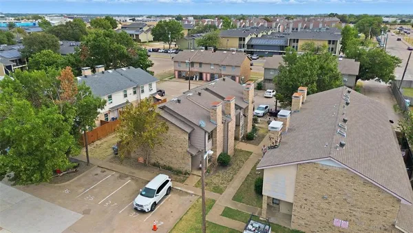 an aerial view of a house with parking space