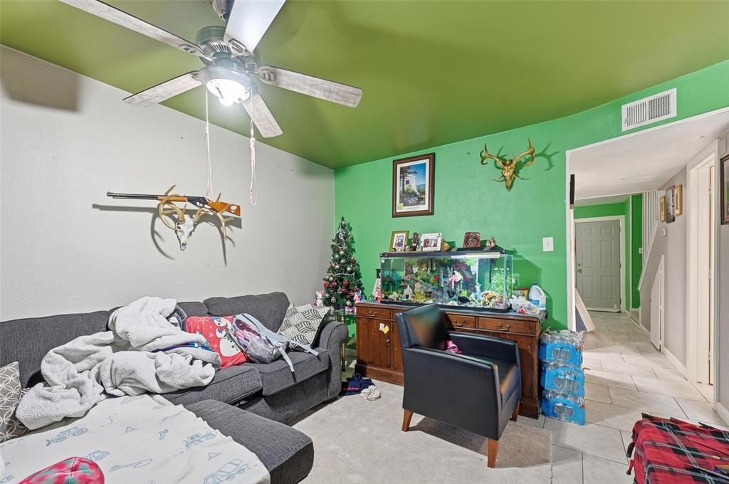 8001 Rothington Road, Unit 3137 Dallas, TX 75227 - Photo 32 of 38 a living room with furniture and a flat screen tv