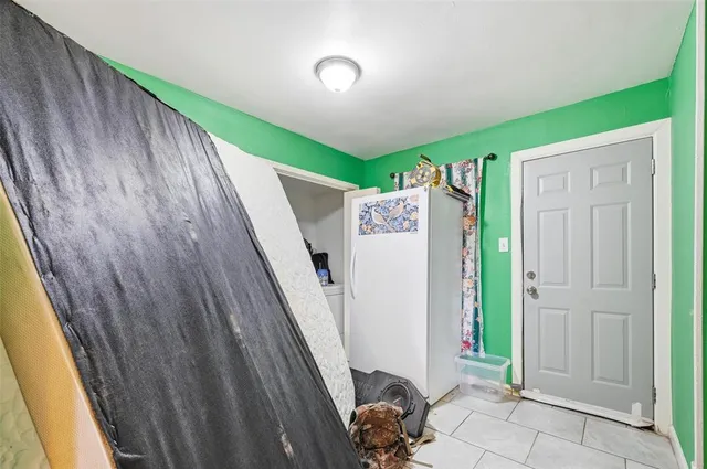 a bathroom with a granite countertop sink a mirror and vanity