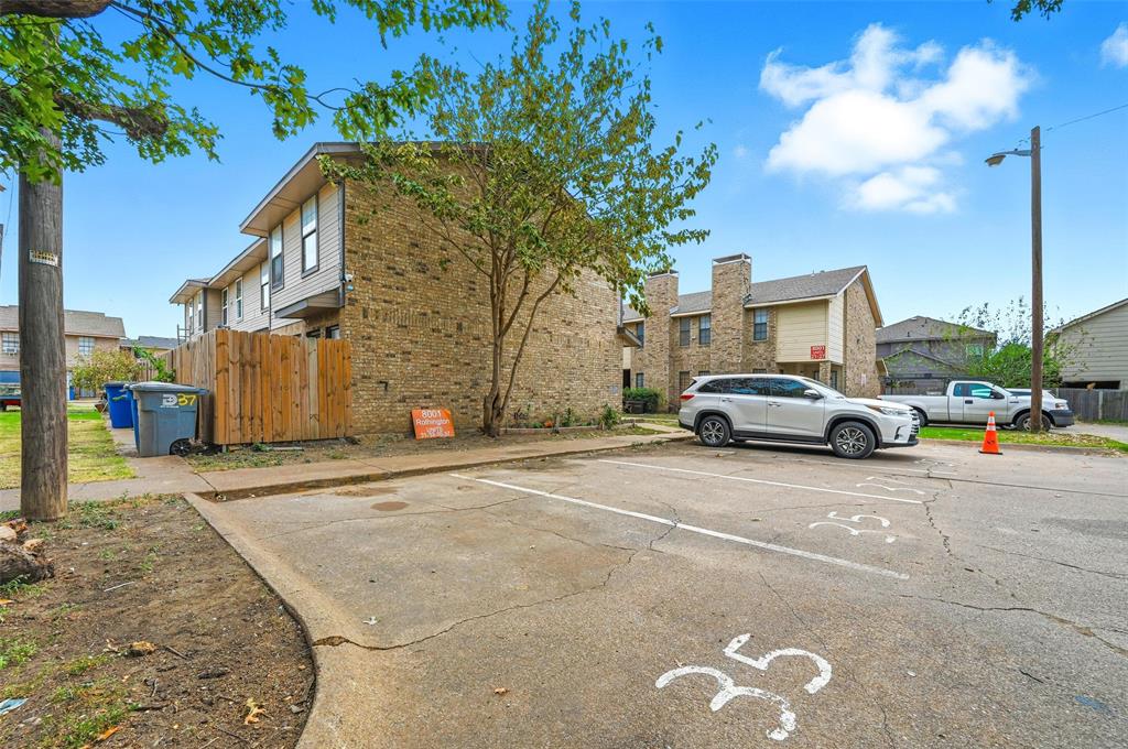 8001 Rothington Road, Unit 3137 Dallas, TX 75227 - Photo 7 of 38 a view of a car parked in front of a house