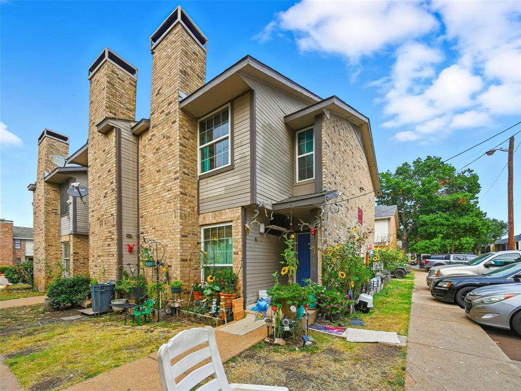 8001 Rothington Road, Unit 3137 Dallas, TX 75227 - Photo 8 of 38 a front view of a house with a yard