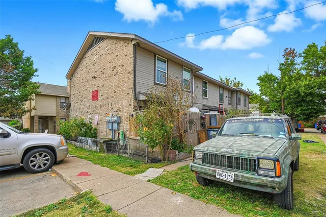 a view of an house with backyard space and a garden