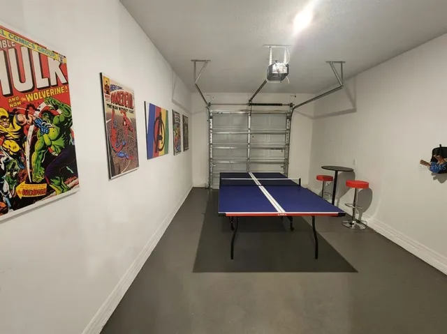 a bedroom with a bed and a television