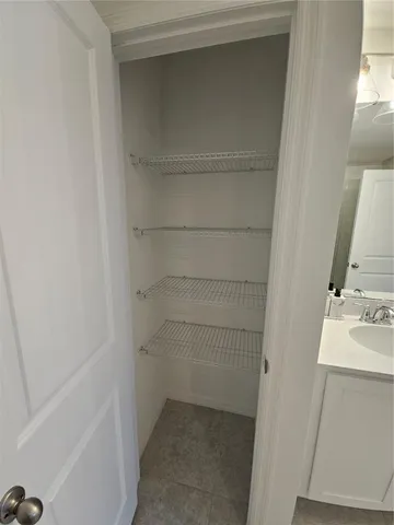 a bedroom with a bed and a desk