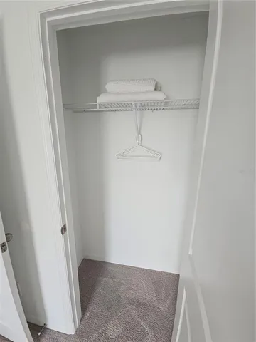 a view of a house that has a table and chairs in patio