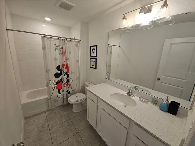 a view of a house with patio and a yard