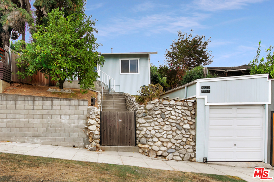 5122 Raphael Street Los Angeles, CA 90042 - Photo 2 of 37 front view of a house with a trees