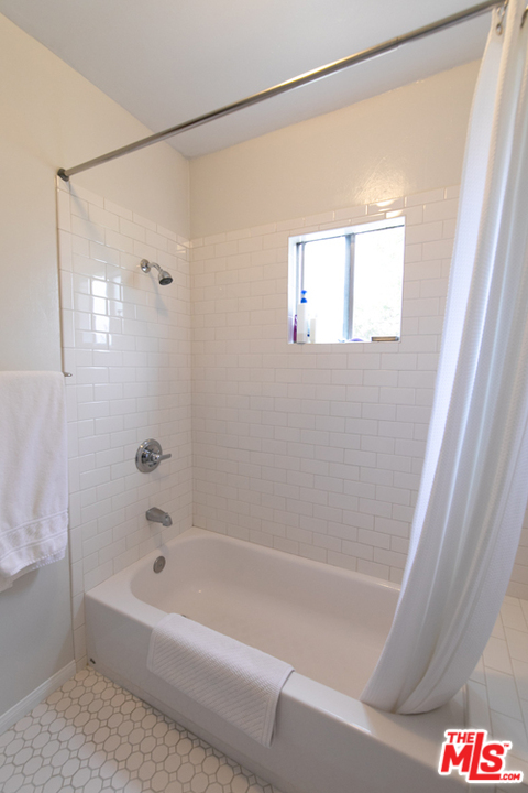 5122 Raphael Street Los Angeles, CA 90042 - Photo 12 of 37 a bathroom with a bathtub and a shower