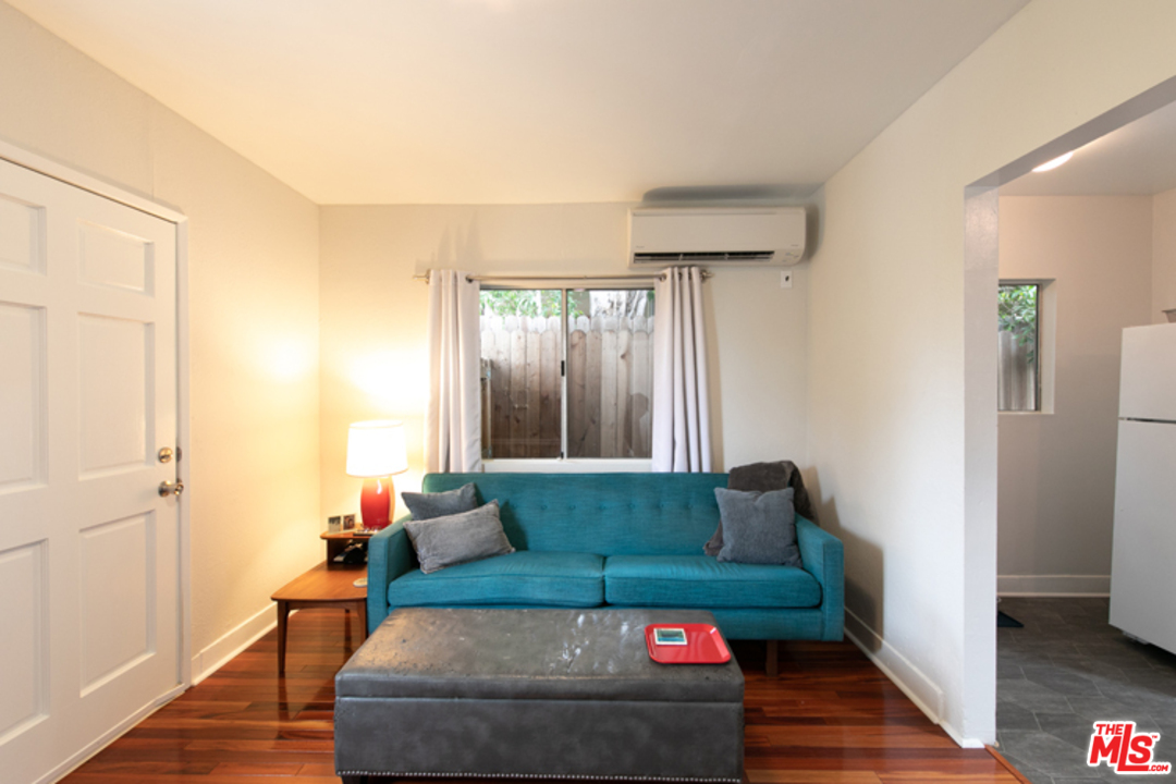 5122 Raphael Street Los Angeles, CA 90042 - Photo 13 of 37 a living room with furniture and a gate