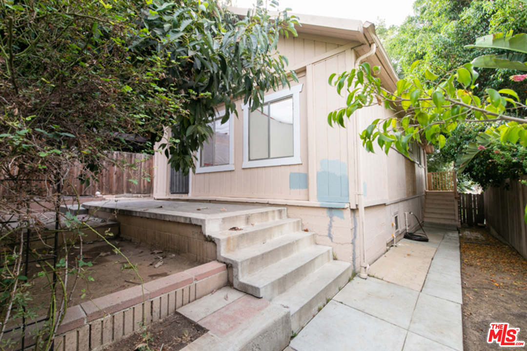 5122 Raphael Street Los Angeles, CA 90042 - Photo 20 of 37 a view of house with backyard and sitting area