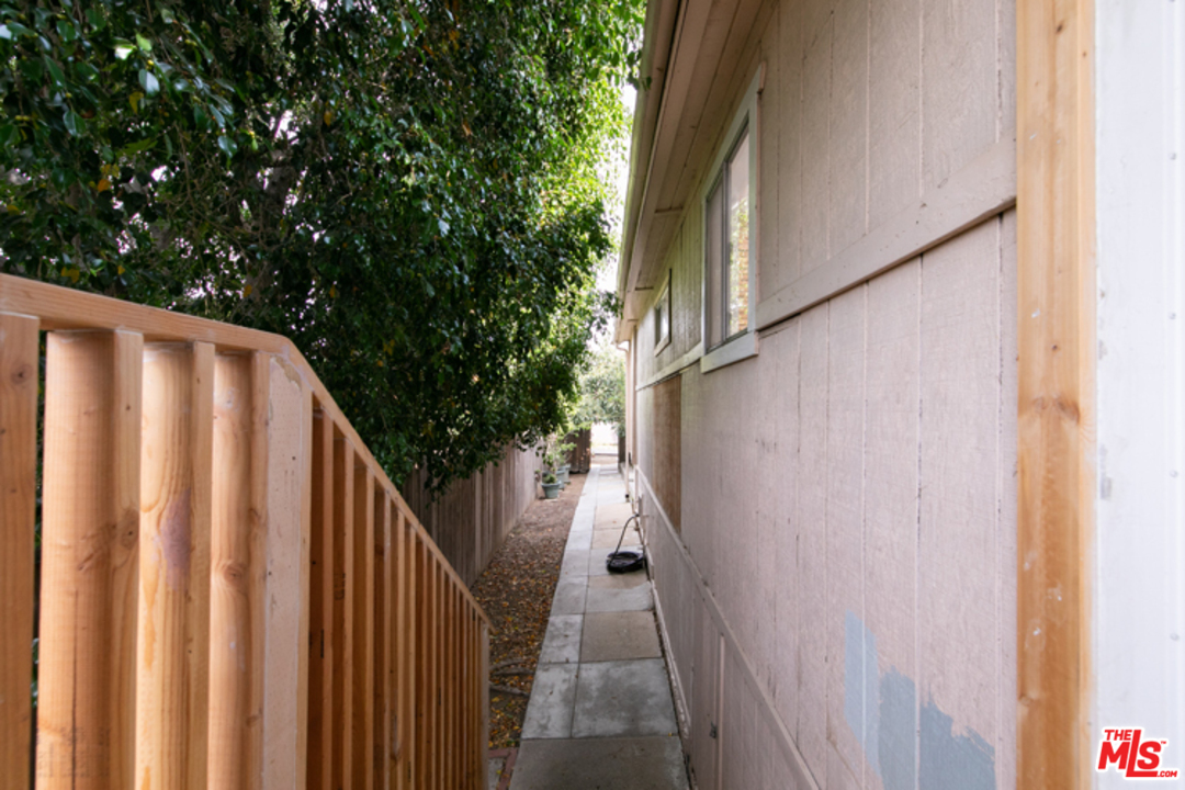 5122 Raphael Street Los Angeles, CA 90042 - Photo 32 of 37 a view of balcony with wooden floor and fence