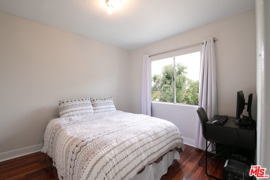 5122 Raphael Street Los Angeles, CA 90042 - Photo 8 of 37 a bedroom with a bed and a window