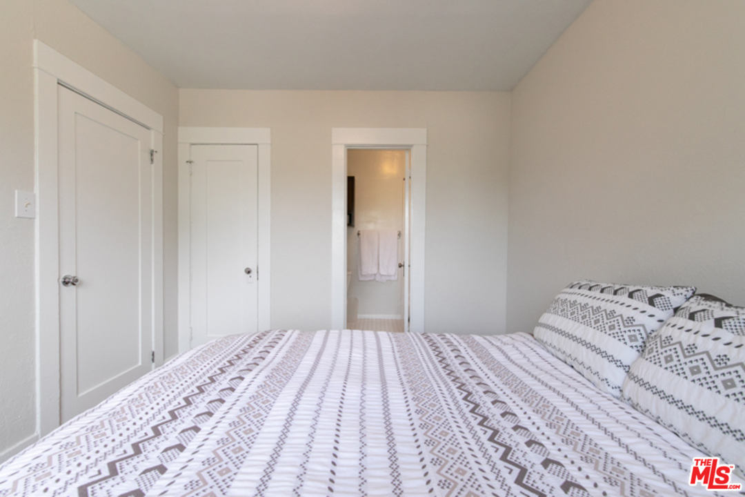 5122 Raphael Street Los Angeles, CA 90042 - Photo 9 of 37 a bedroom with a bed and a window