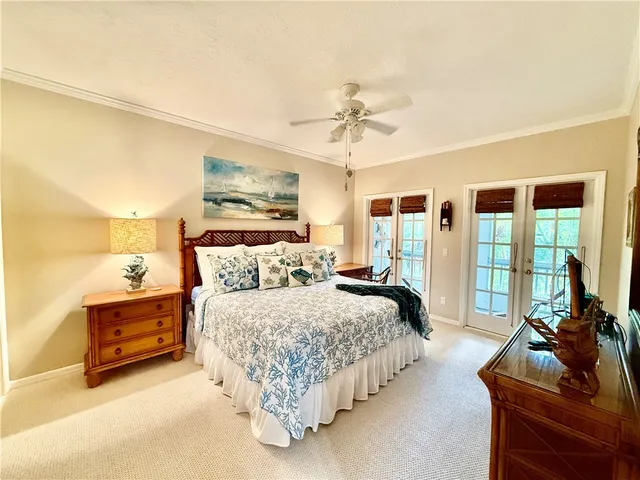 a view of a lake with a house in the background