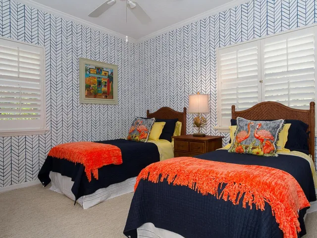 a bedroom with a bed and dresser