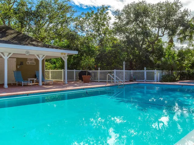 a view of a swimming pool with a patio