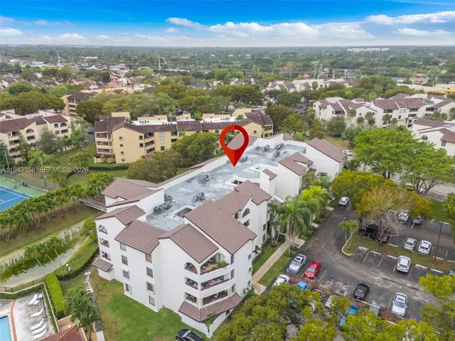 an aerial view of residential houses with outdoor space