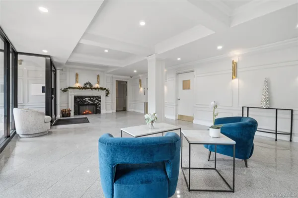 a living room with furniture a fireplace and a table