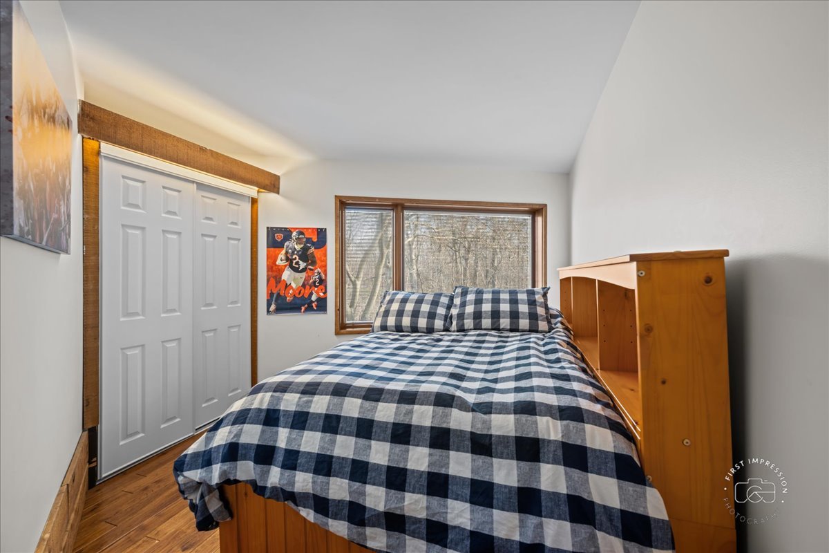 3N286 Klein Road West Chicago, IL 60185 - Photo 21 of 44 a bedroom with a bed and wooden floor