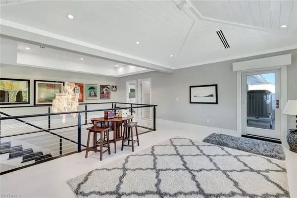 a view of entryway livingroom and hall with wooden floor