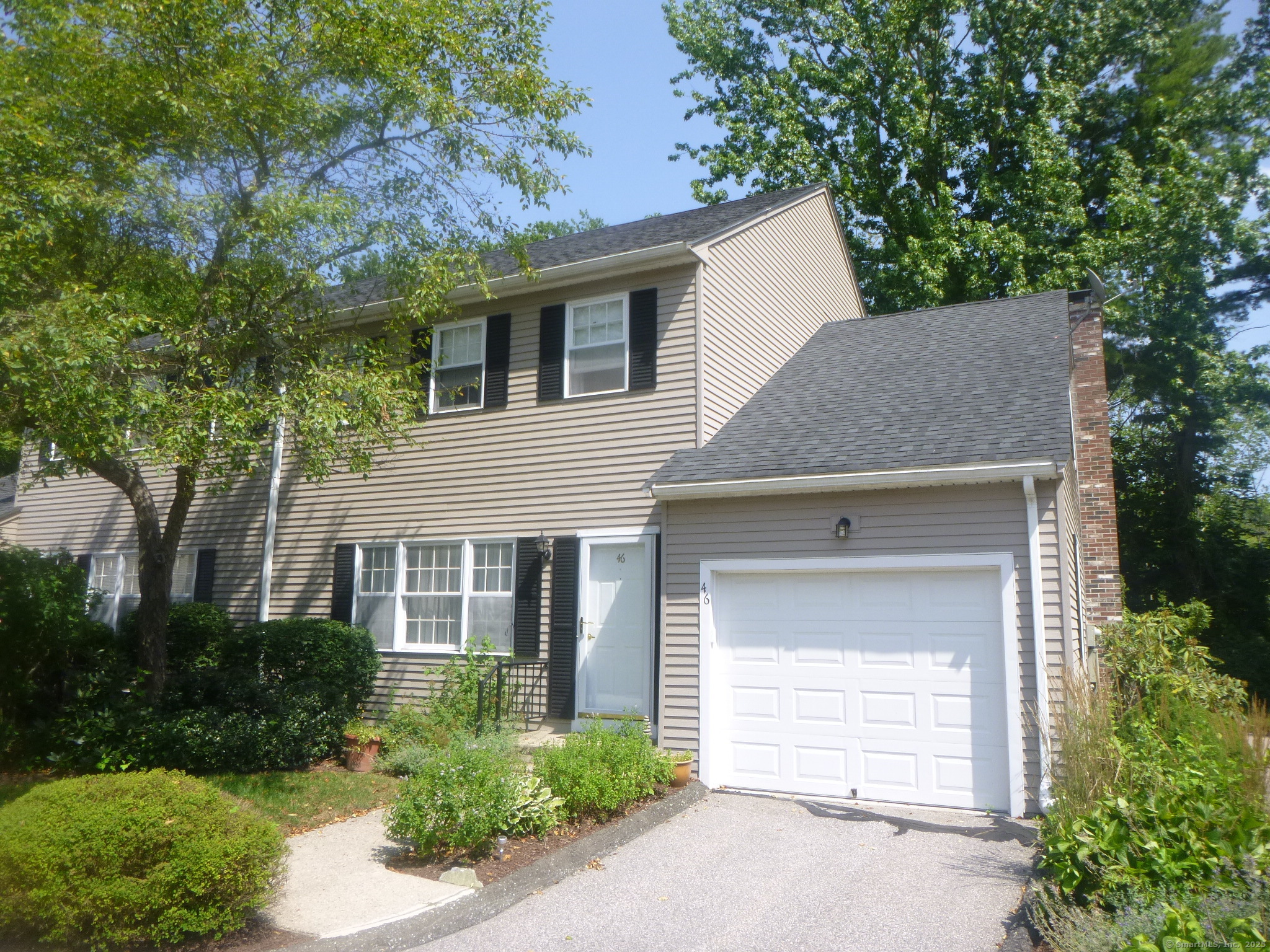 Attached garage, quiet location and end unit!