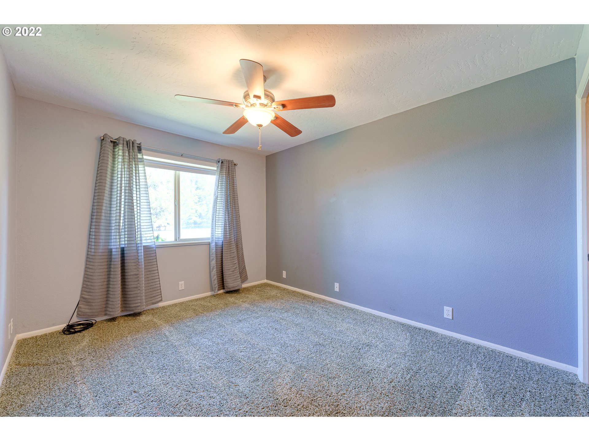95525 West Huckleberry Ridge Road Brookings, OR 97415 - Photo 25 of 32 a view of an empty room and window