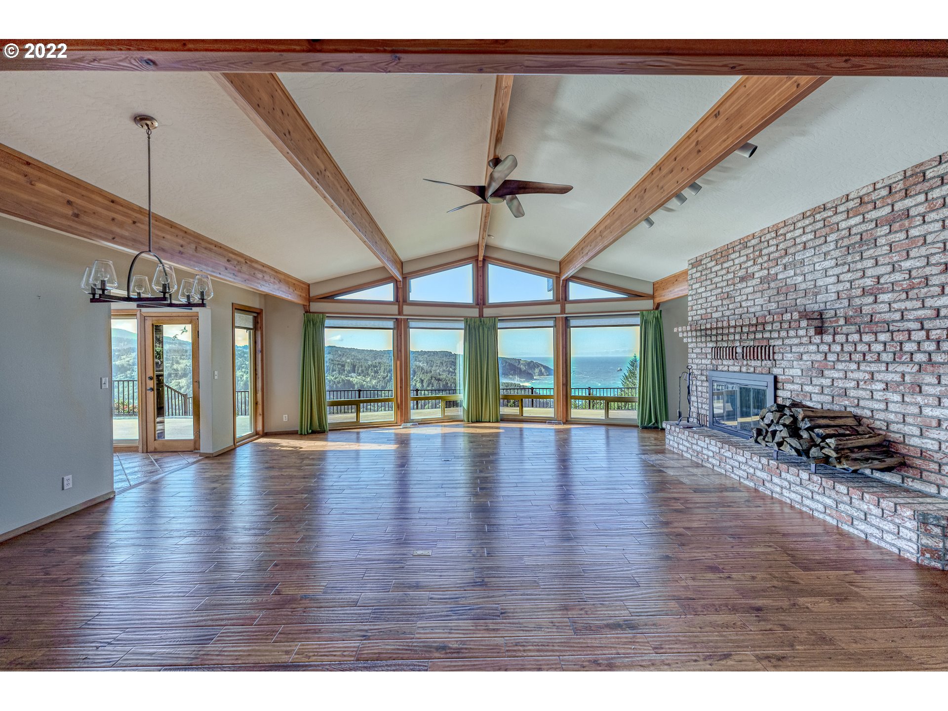 95525 West Huckleberry Ridge Road Brookings, OR 97415 - Photo 4 of 32 a view interior of a house wooden floor and windows