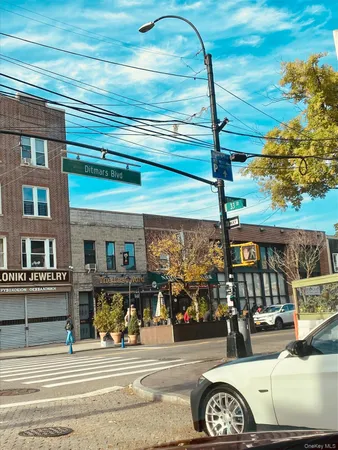 a front view of a building with parking area