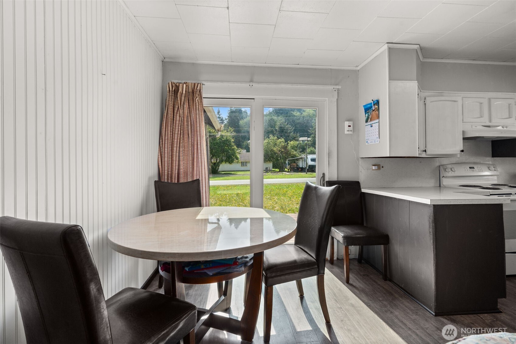1206 West 4th Street South Bend, WA 98586 - Photo 11 of 29 a view of a dining room with furniture and a window