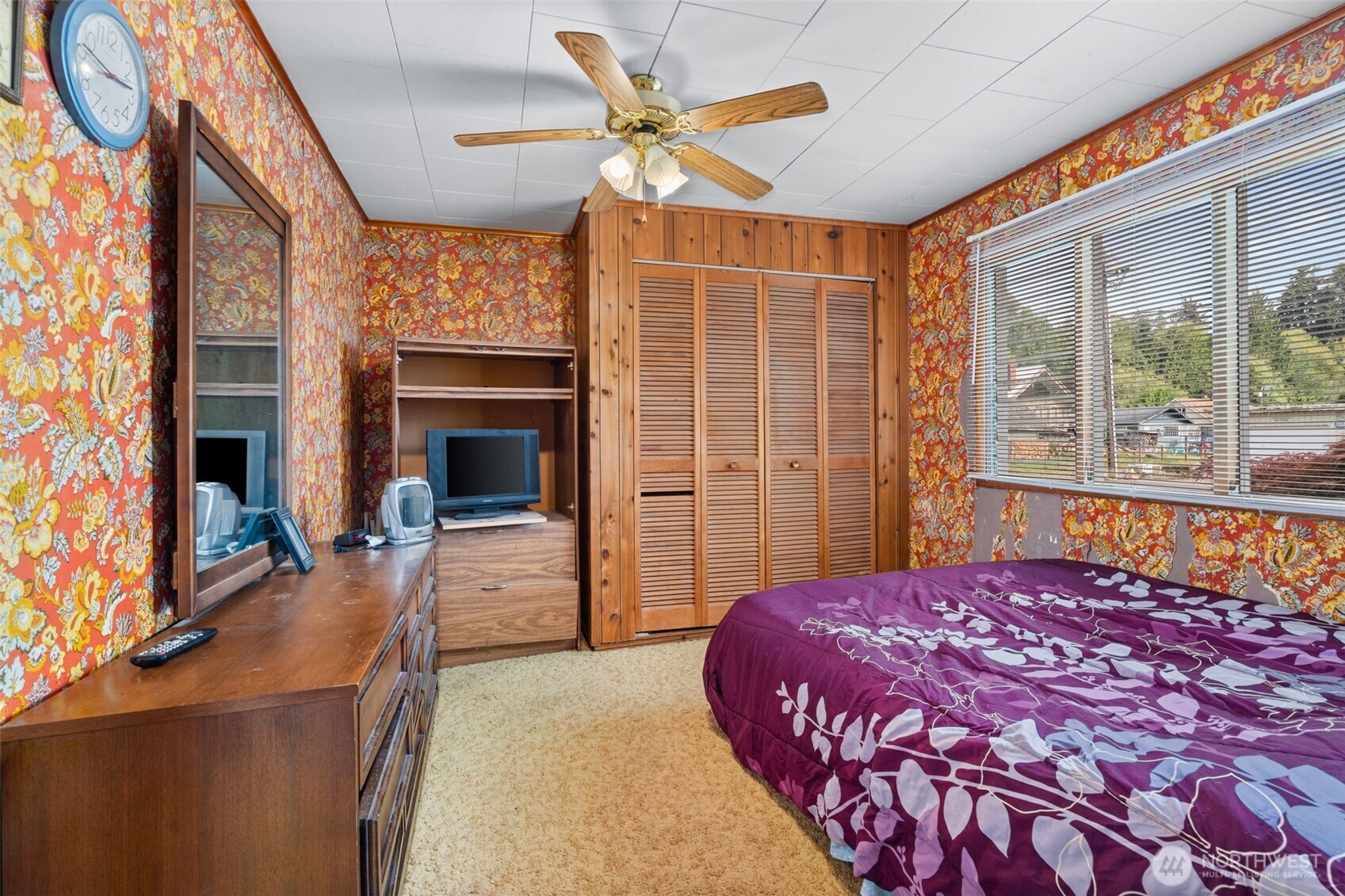 1206 West 4th Street South Bend, WA 98586 - Photo 12 of 29 a bedroom with a bed and a large window with outer view