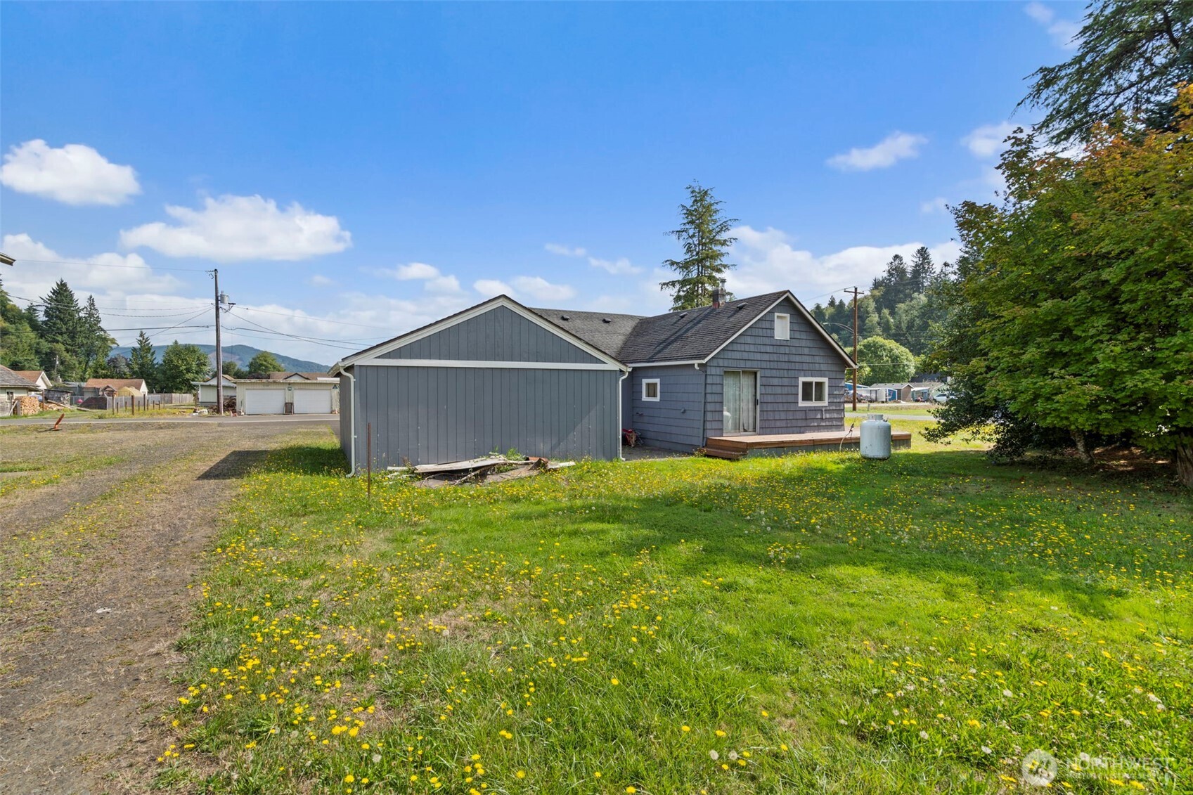 1206 West 4th Street South Bend, WA 98586 - Photo 20 of 29 a front view of a house with garden