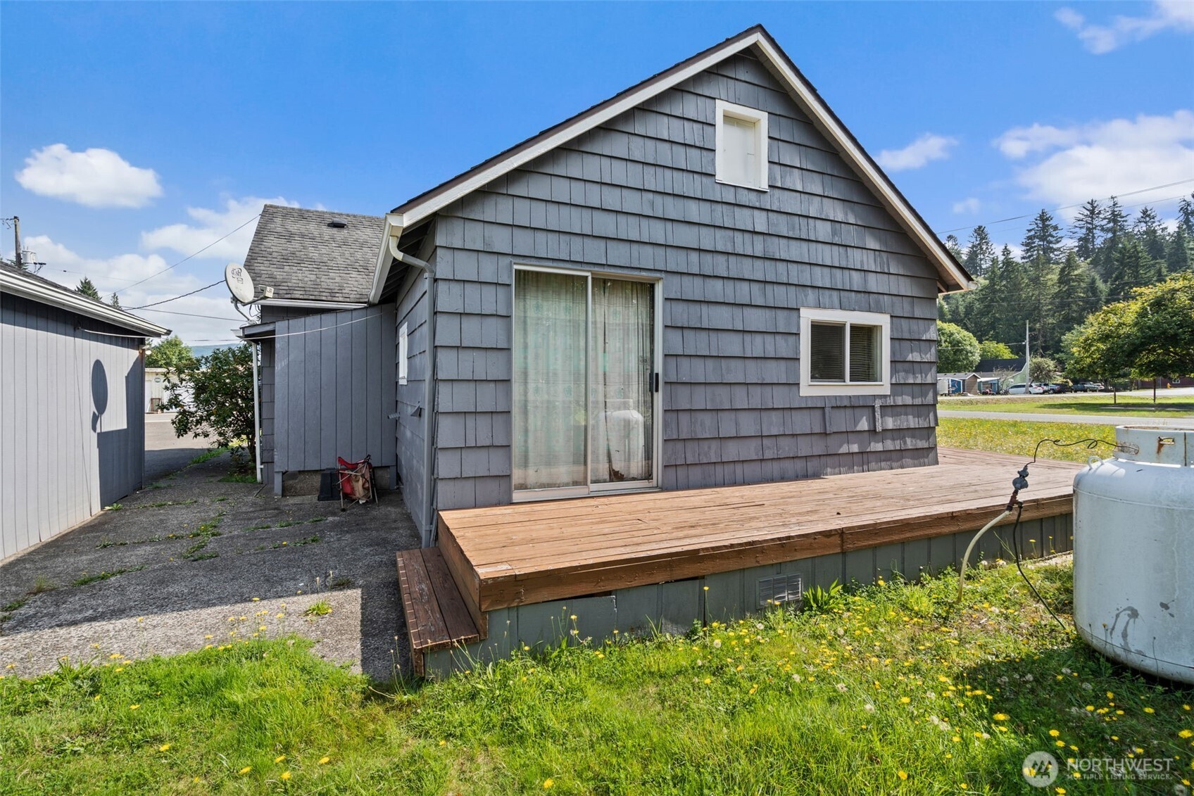 1206 West 4th Street South Bend, WA 98586 - Photo 21 of 29 a front view of a house with garden