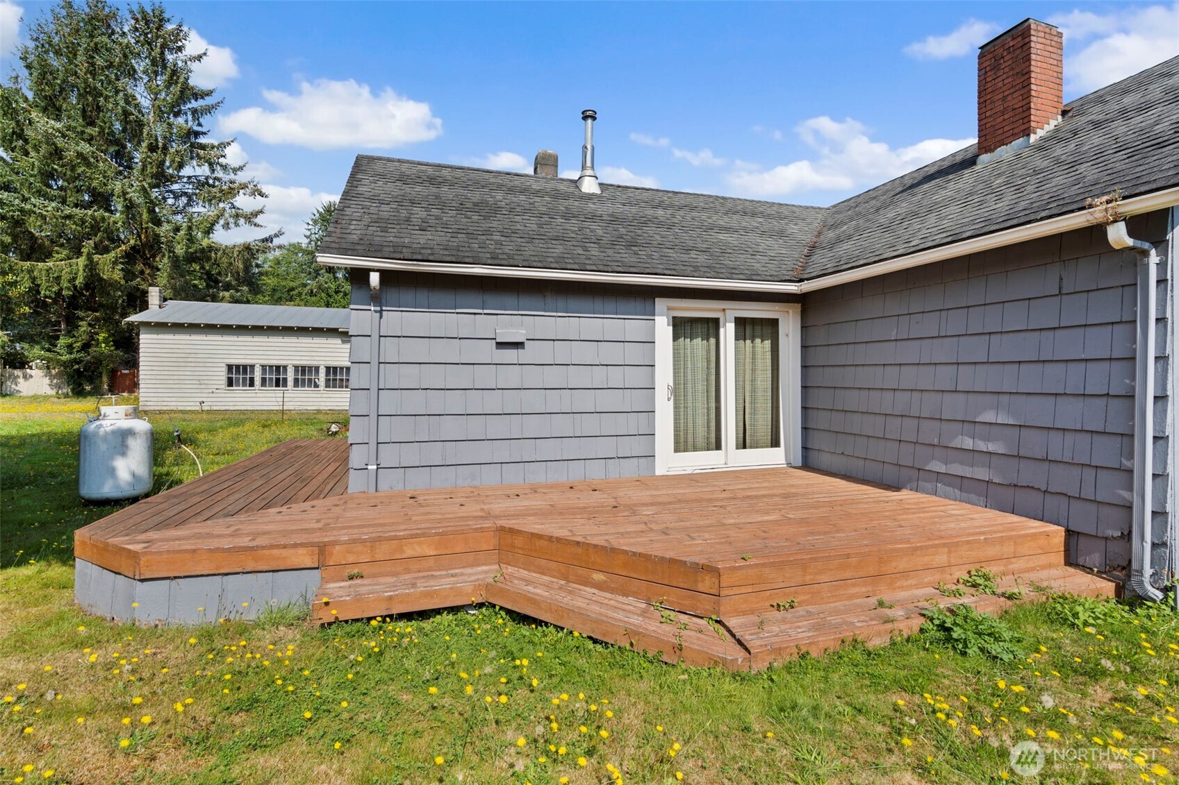 1206 West 4th Street South Bend, WA 98586 - Photo 24 of 29 a front view of a house with garden