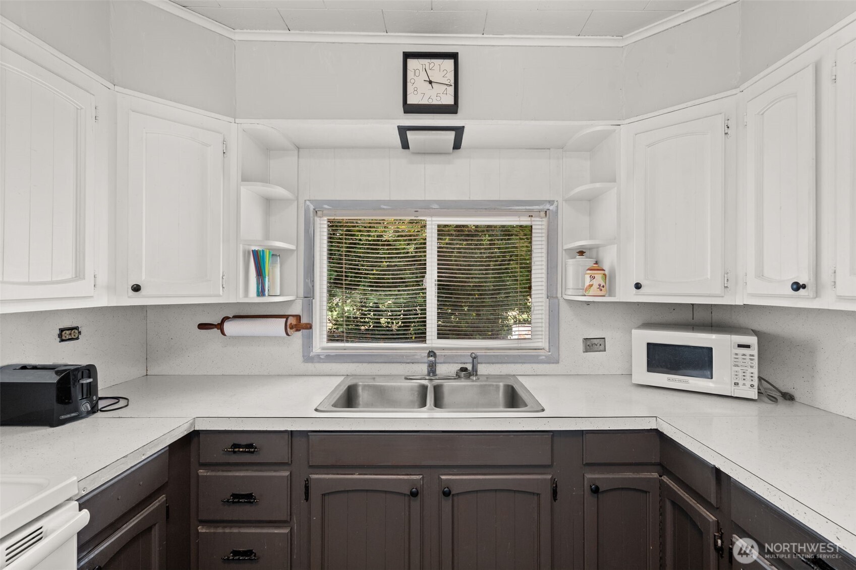1206 West 4th Street South Bend, WA 98586 - Photo 9 of 29 a kitchen with stainless steel appliances a sink a stove and cabinets