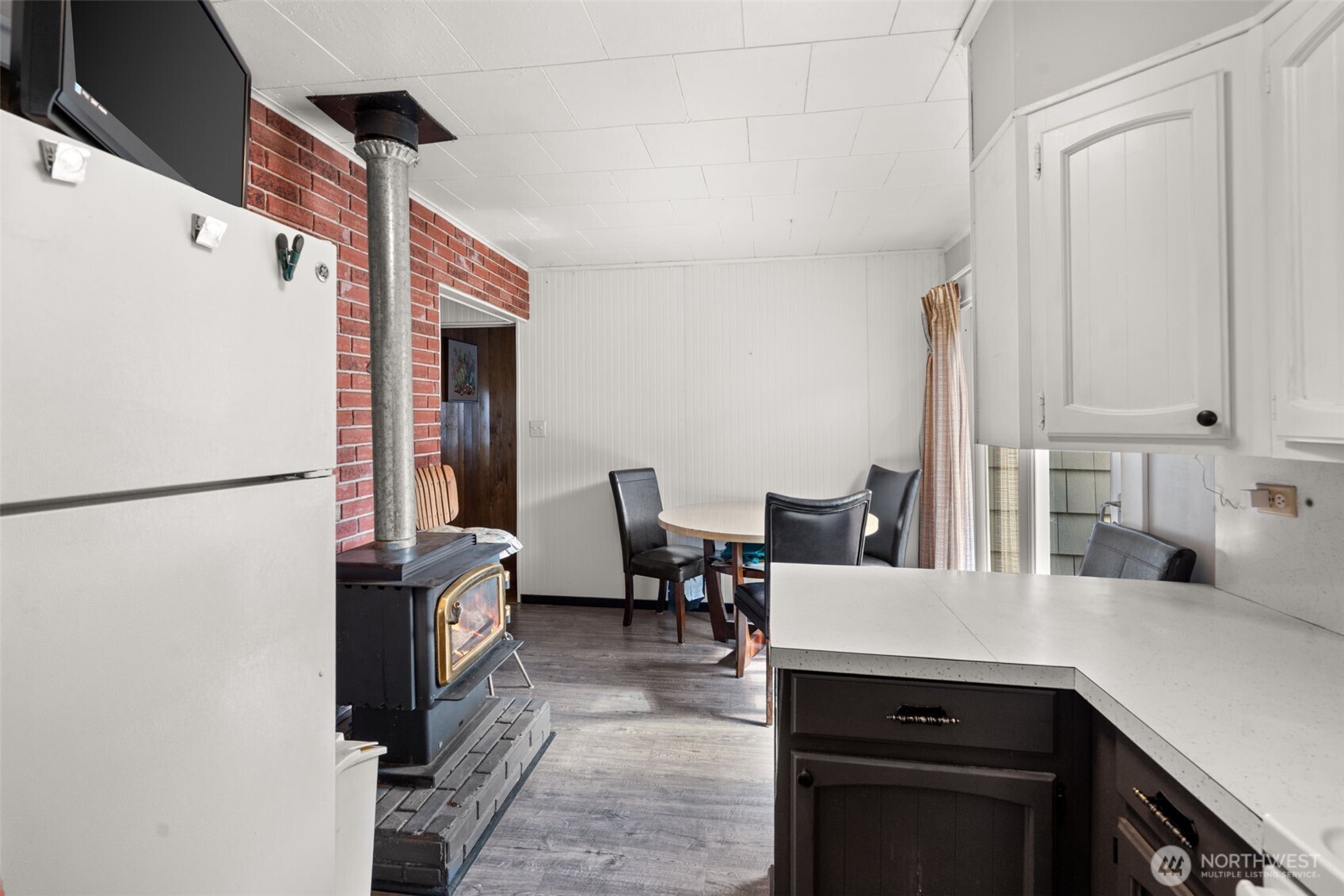 1206 West 4th Street South Bend, WA 98586 - Photo 10 of 29 a kitchen with kitchen island a sink appliances and cabinets