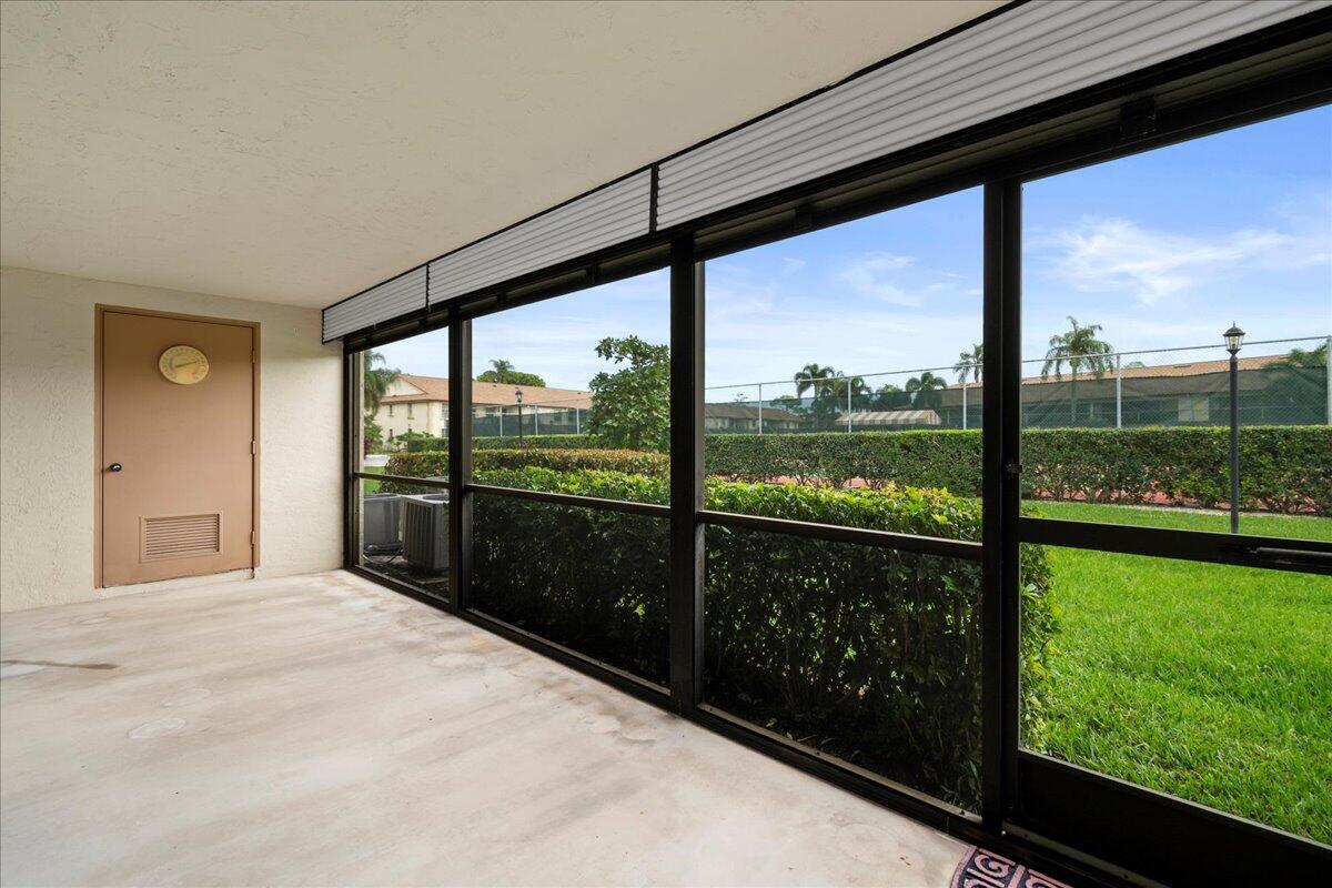 301 Pinecrest Circle, Unit C Jupiter, FL 33458 - Photo 25 of 36 Screened Patio with Storage Closet