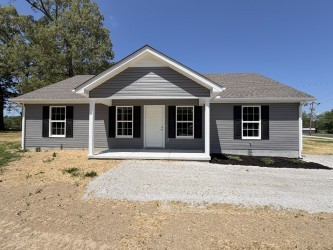 74 6 Mile Board Road Winchester, TN 37398 - Photo 1 of 99 a front view of a house with a yard