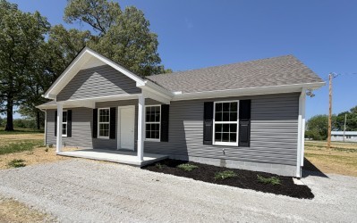 74 6 Mile Board Road Winchester, TN 37398 - Photo 2 of 99 a front view of a house with a yard and garage