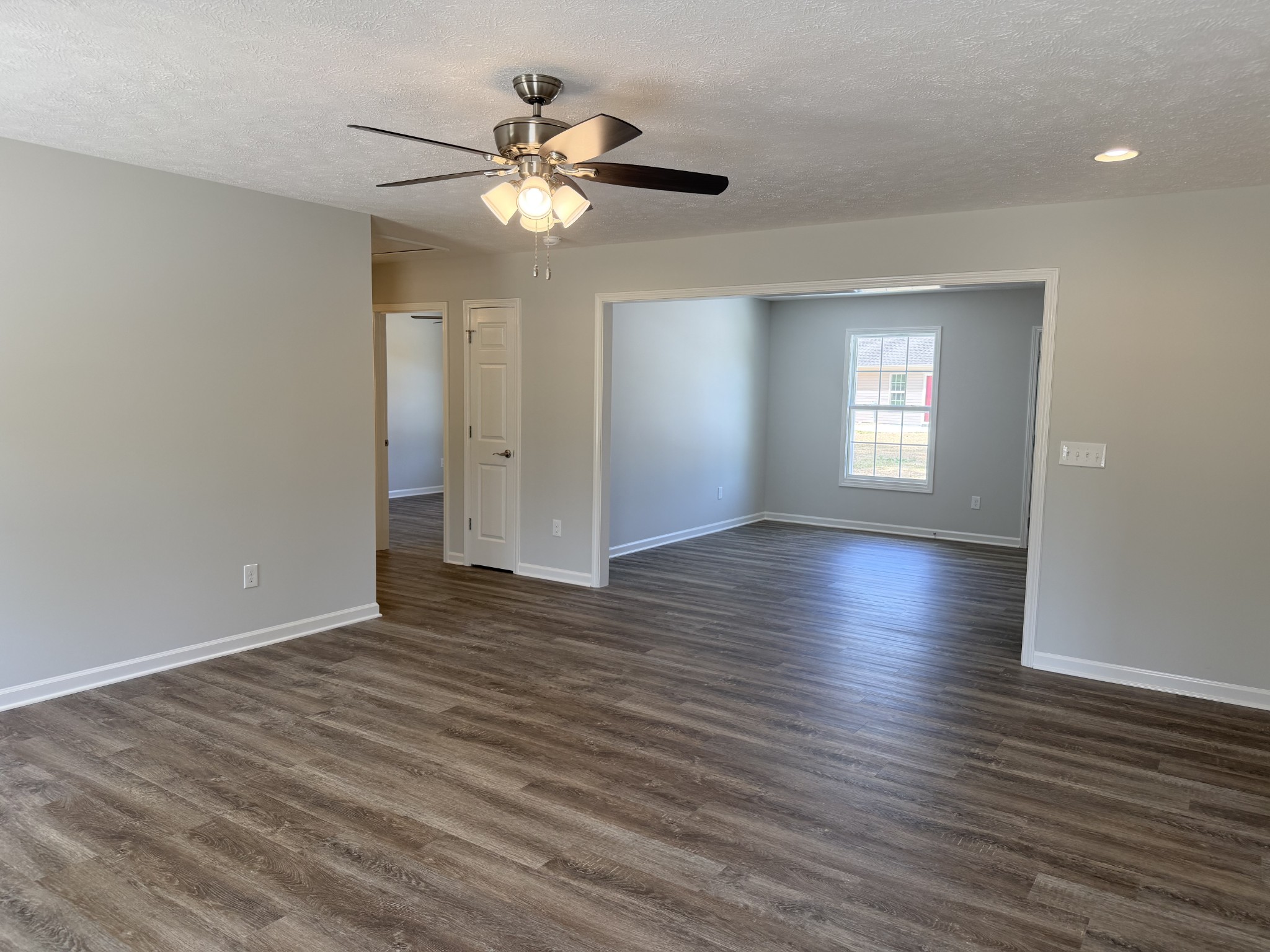 74 6 Mile Board Road Winchester, TN 37398 - Photo 27 of 99 a view of an empty room with wooden floor and a window