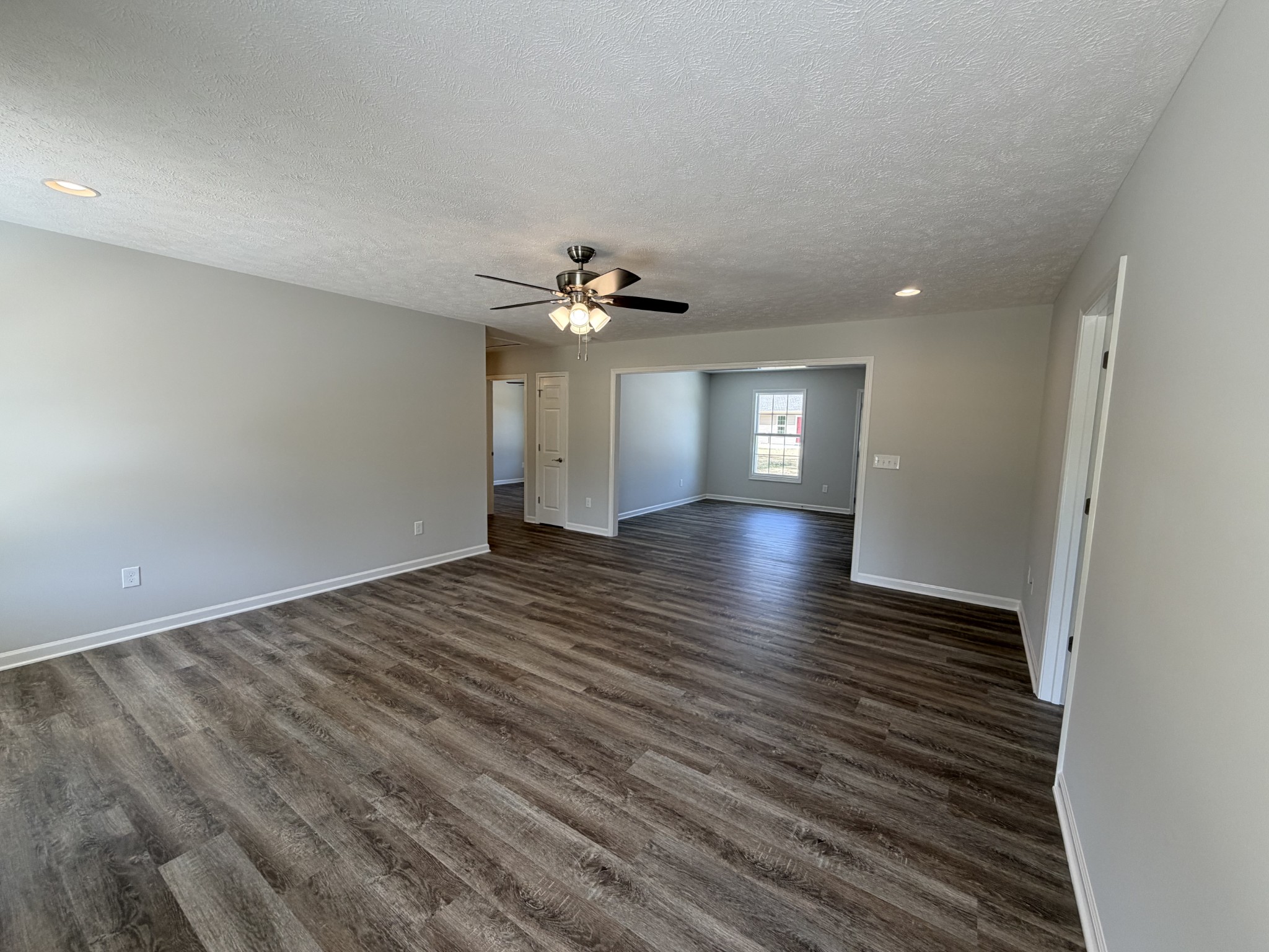 74 6 Mile Board Road Winchester, TN 37398 - Photo 28 of 99 wooden floor in an empty room with a window