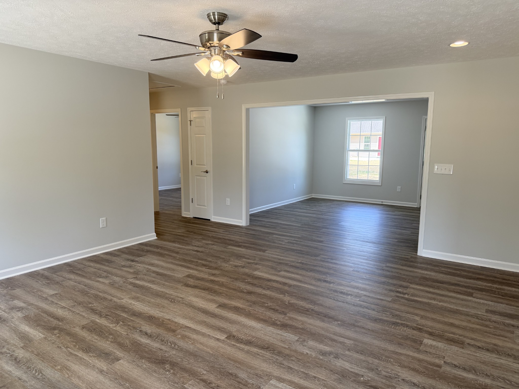 74 6 Mile Board Road Winchester, TN 37398 - Photo 29 of 99 a view of an empty room with a window and wooden floor