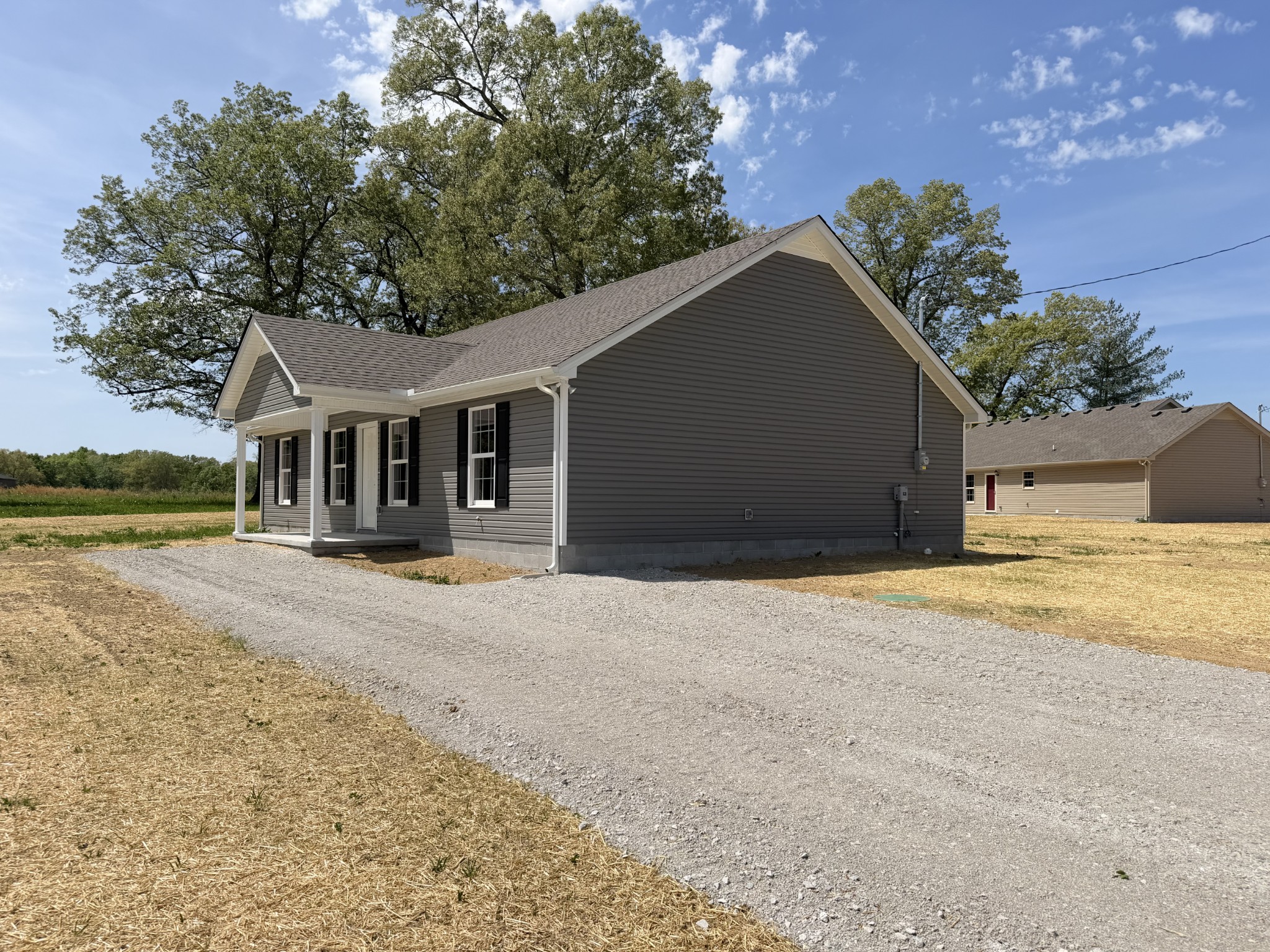74 6 Mile Board Road Winchester, TN 37398 - Photo 3 of 99 a front view of a house with a yard and garage
