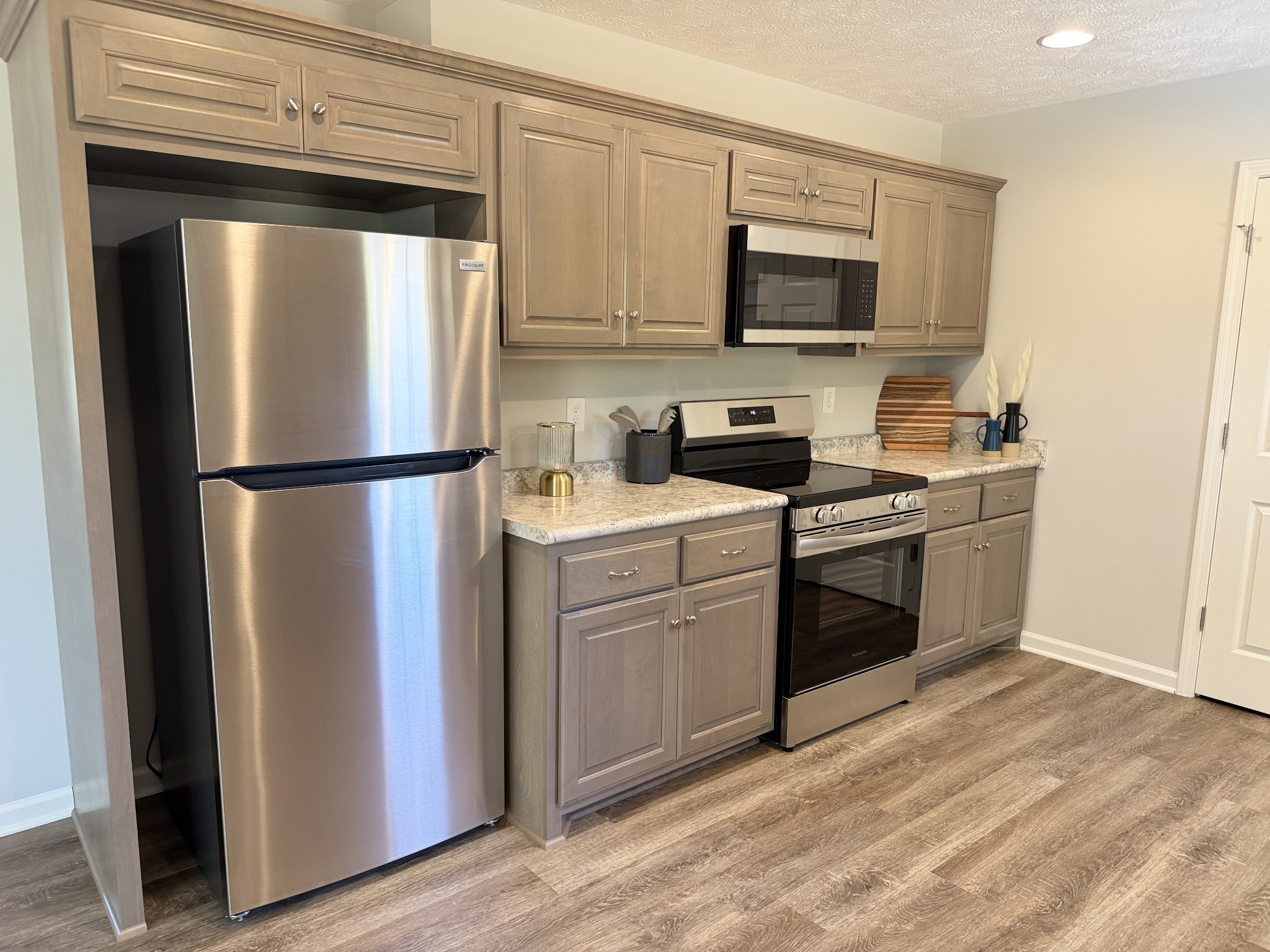 74 6 Mile Board Road Winchester, TN 37398 - Photo 31 of 99 a kitchen with a refrigerator stove and microwave