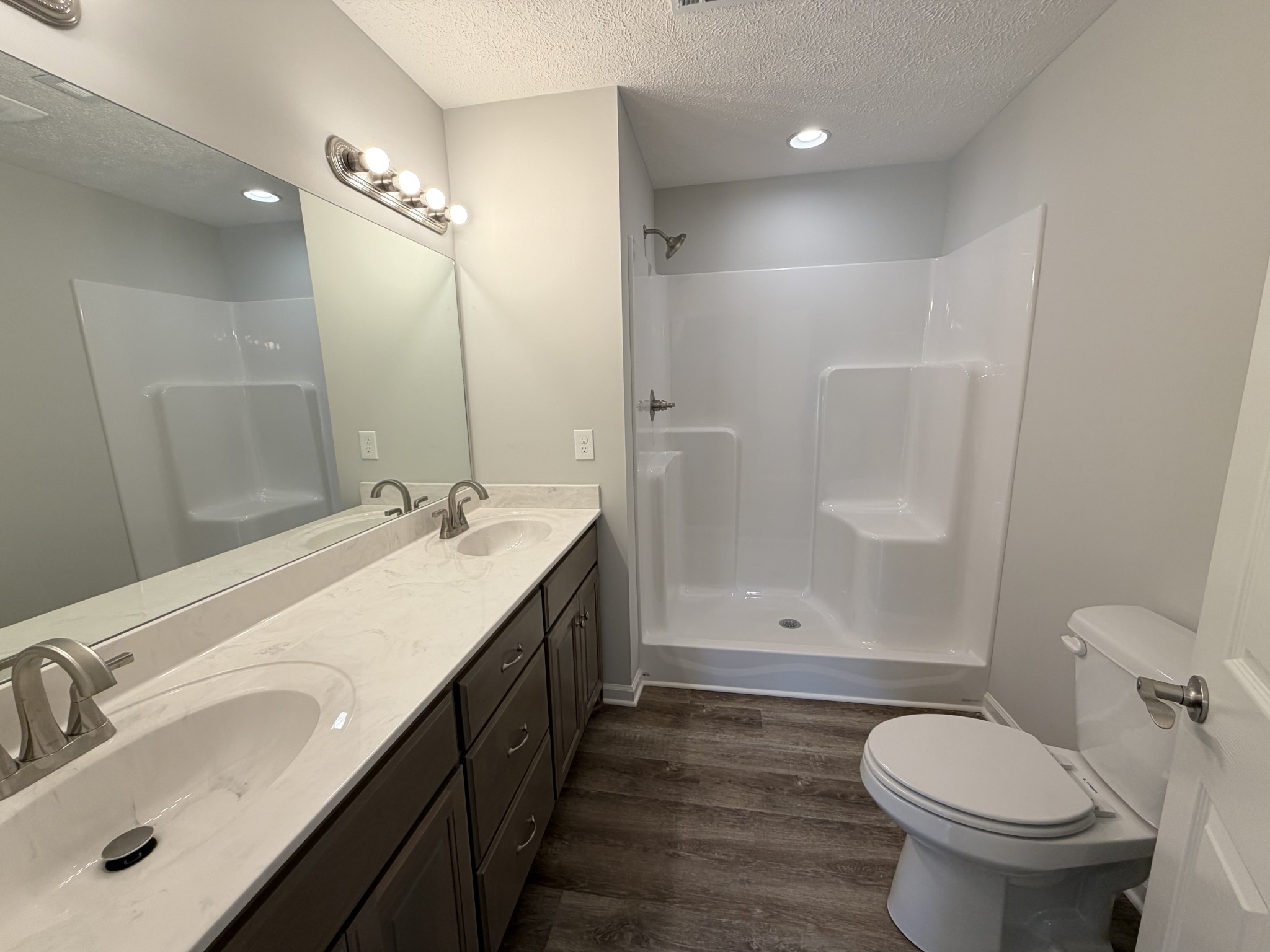 74 6 Mile Board Road Winchester, TN 37398 - Photo 35 of 99 a bathroom with a double vanity sink toilet and shower