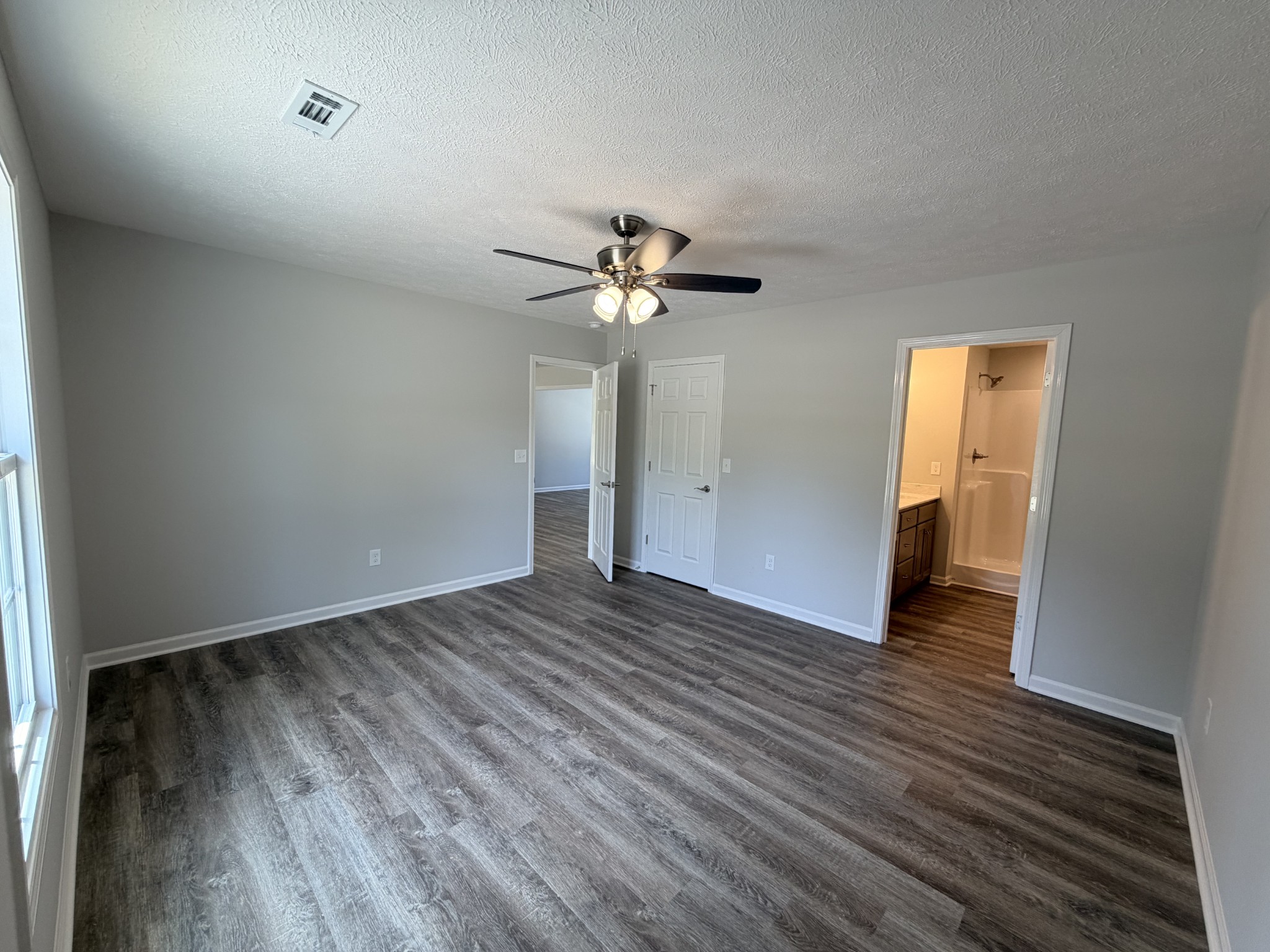74 6 Mile Board Road Winchester, TN 37398 - Photo 40 of 99 wooden floor in an empty room with a window