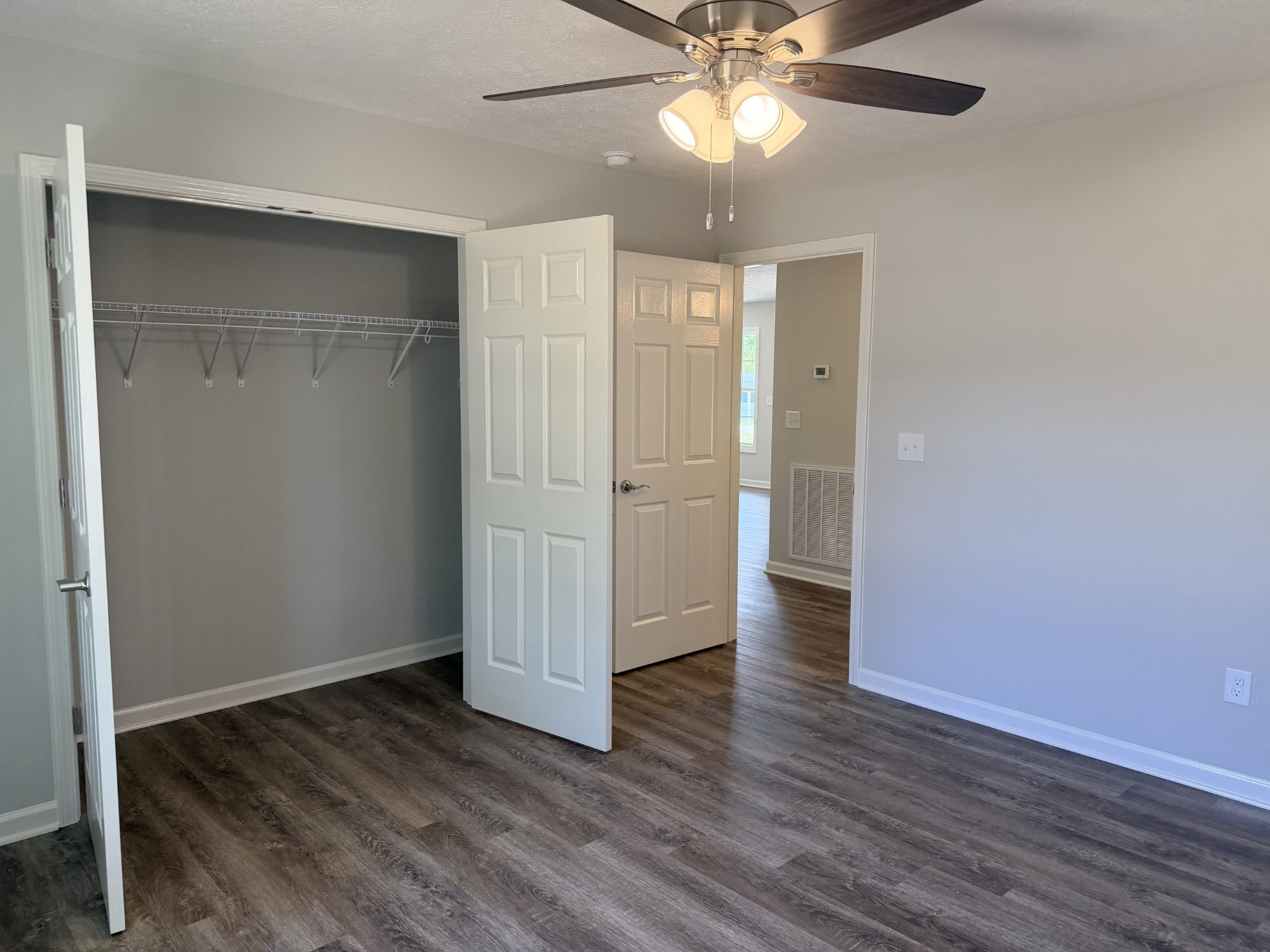74 6 Mile Board Road Winchester, TN 37398 - Photo 55 of 99 an empty room with wooden floor closet and windows