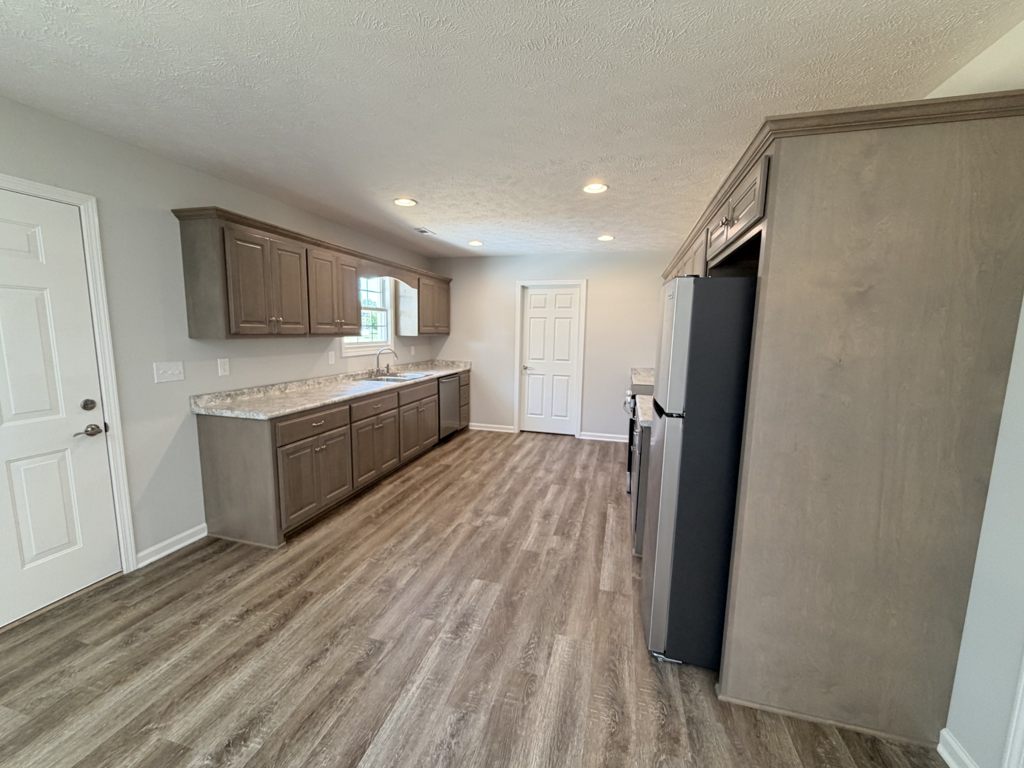 74 6 Mile Board Road Winchester, TN 37398 - Photo 69 of 99 a large kitchen with a sink and refrigerator