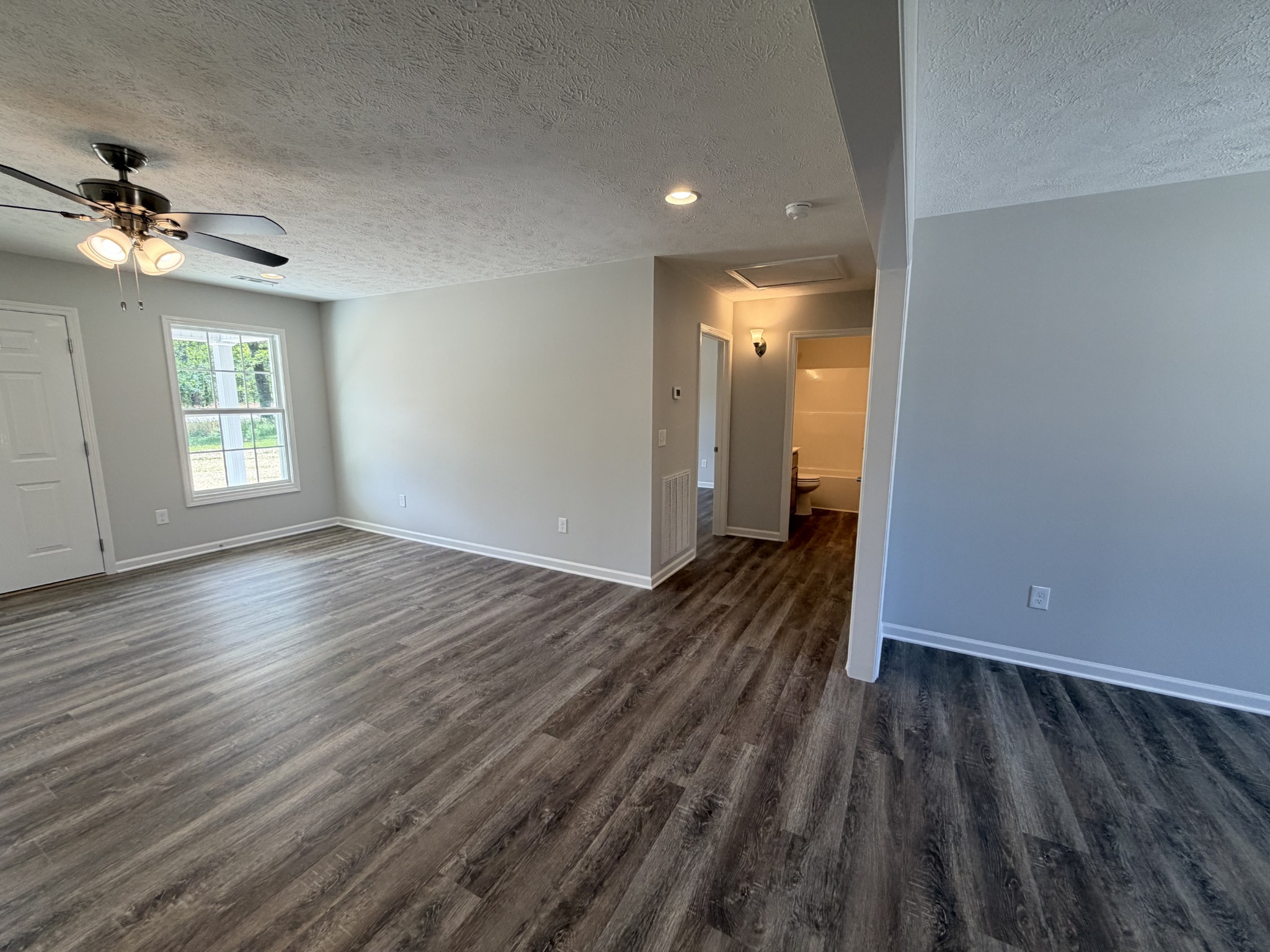74 6 Mile Board Road Winchester, TN 37398 - Photo 73 of 99 wooden floor in an empty room with a window